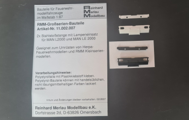 Stahlstoßstange m. Lampeneinsatz f. MAN L2000/LE 2000  1x weiß 1x schwarz 11.002.007